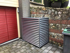 geluidskast warmtepomp tegen muur